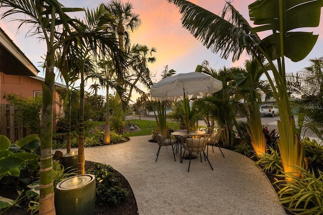 view of patio terrace at dusk