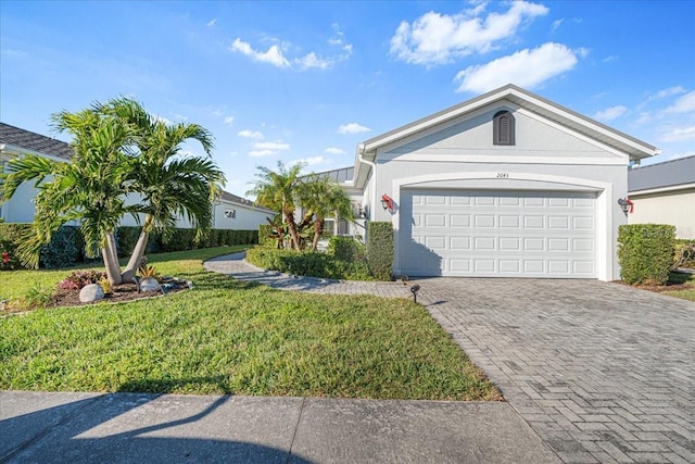 ranch-style house with a front lawn and a garage