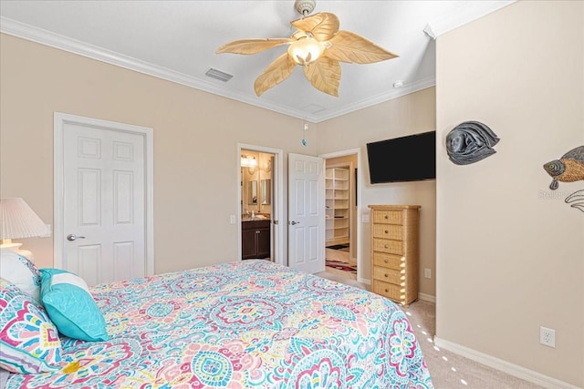 bedroom with connected bathroom, light colored carpet, ceiling fan, and crown molding