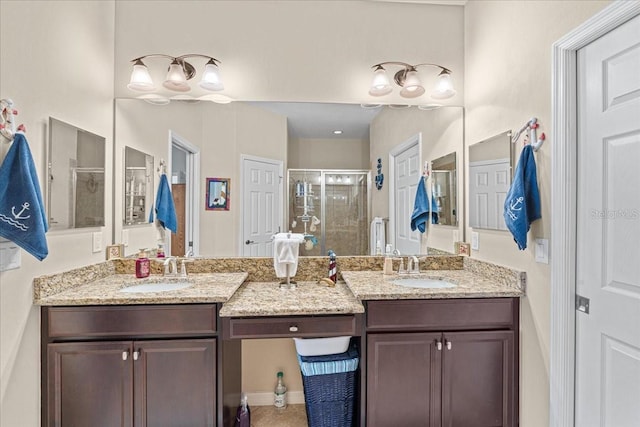 bathroom featuring vanity and an enclosed shower