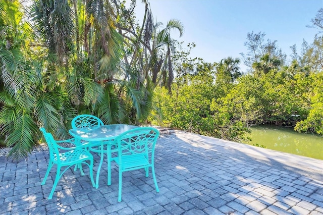 view of patio / terrace featuring a water view