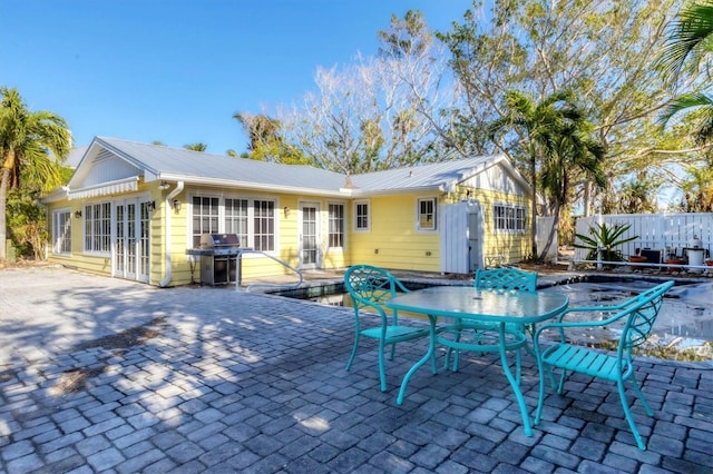 rear view of house featuring a patio