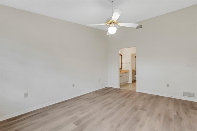 spare room featuring light hardwood / wood-style flooring and ceiling fan