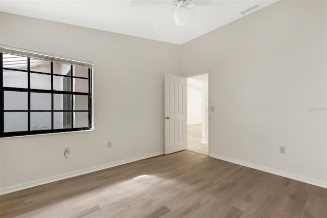 unfurnished room featuring ceiling fan and light hardwood / wood-style floors