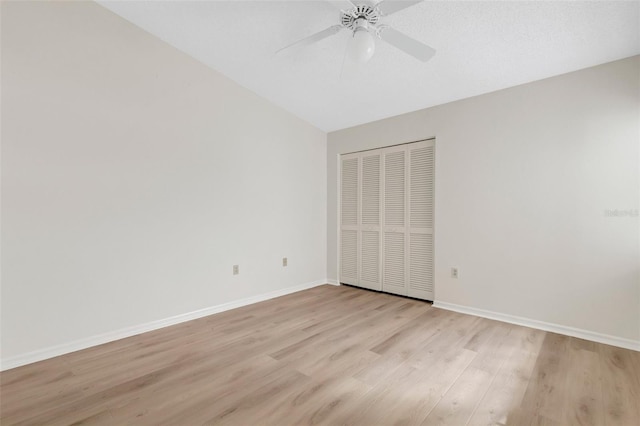 empty room featuring ceiling fan and light hardwood / wood-style flooring