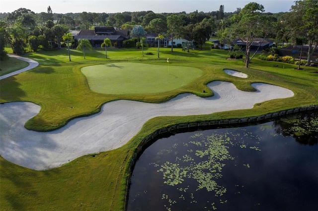 surrounding community with a water view