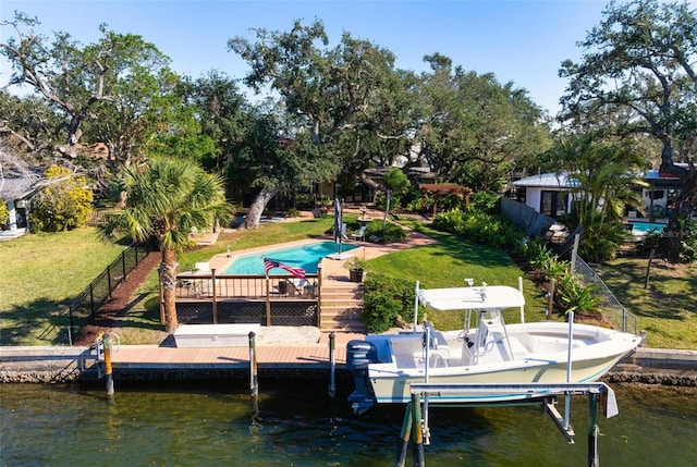 dock area featuring a water view and a yard