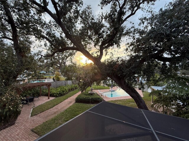 view of community with a patio, fence, and a pool