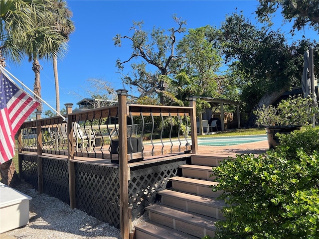 wooden deck featuring an outdoor pool