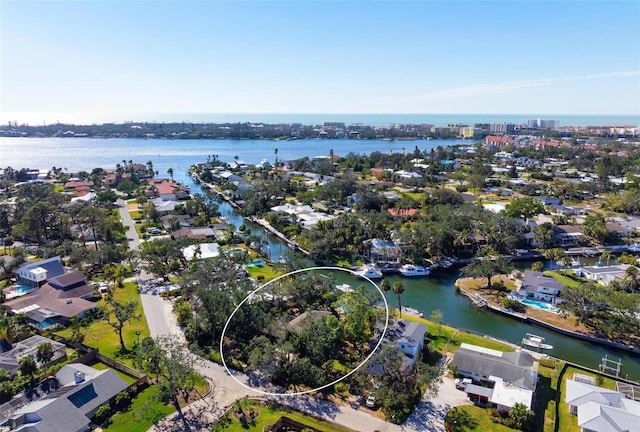 bird's eye view featuring a residential view and a water view