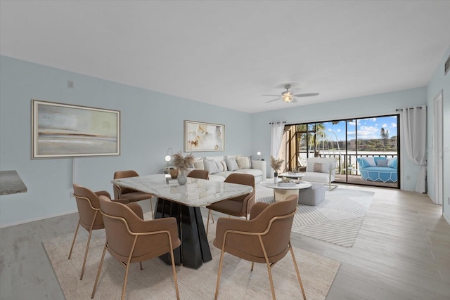 dining room featuring light hardwood / wood-style floors and ceiling fan