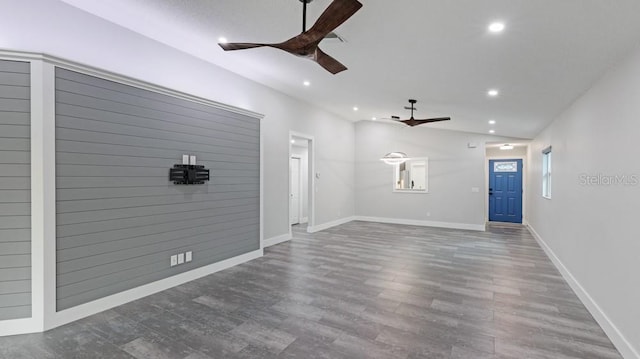 unfurnished living room featuring hardwood / wood-style floors and ceiling fan