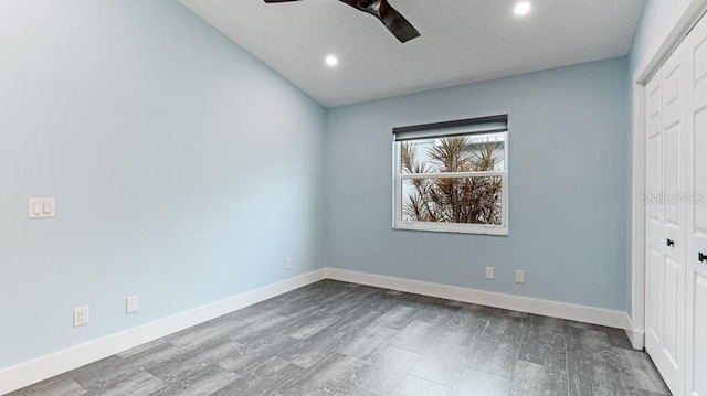 unfurnished bedroom featuring wood-type flooring, a closet, and ceiling fan