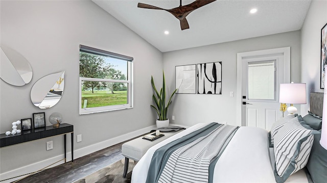 bedroom with dark hardwood / wood-style flooring, ceiling fan, and lofted ceiling