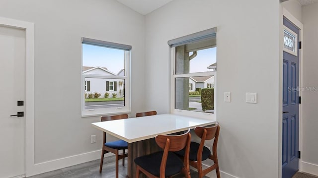 dining area featuring dark hardwood / wood-style floors