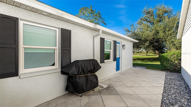 view of patio featuring a grill