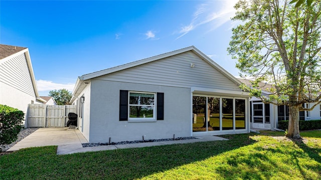 rear view of house with a lawn