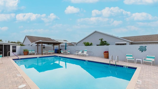 view of swimming pool with a gazebo and a patio