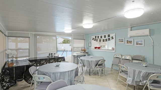 dining space with light tile patterned floors and a wall mounted air conditioner