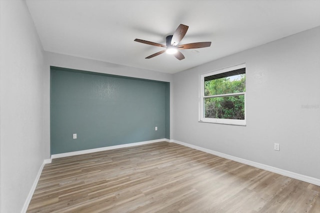 spare room with ceiling fan and light hardwood / wood-style flooring