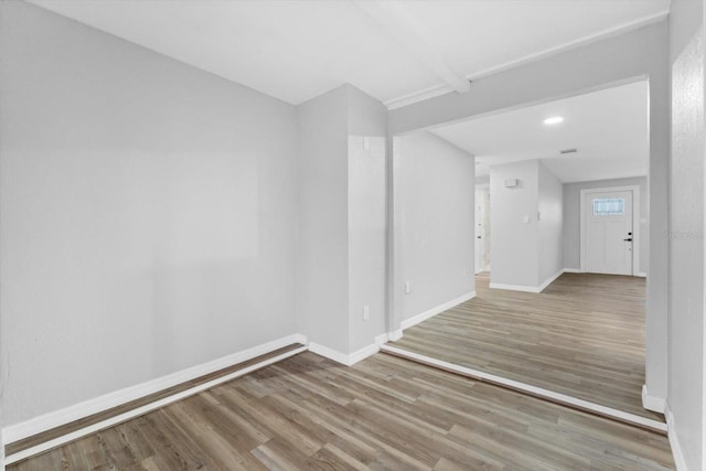 spare room featuring light hardwood / wood-style flooring