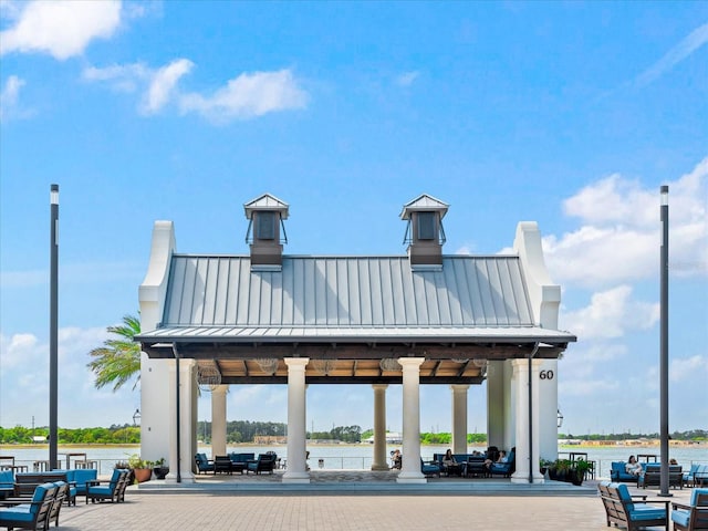 view of community featuring a gazebo and a water view