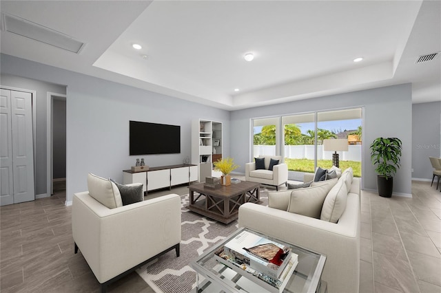 living room with a tray ceiling