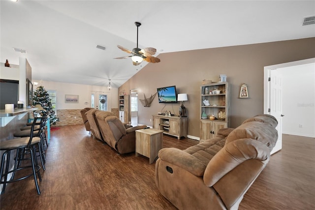 living room with ceiling fan, dark hardwood / wood-style flooring, and vaulted ceiling