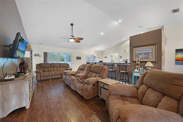 living room with dark hardwood / wood-style flooring, vaulted ceiling, and ceiling fan