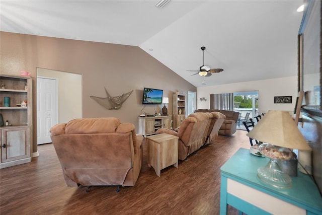 living room featuring dark hardwood / wood-style flooring, vaulted ceiling, and ceiling fan