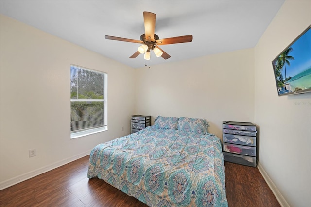 bedroom featuring ceiling fan and dark hardwood / wood-style flooring