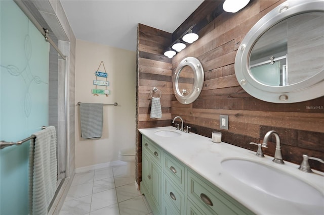 bathroom with wood walls, vanity, an enclosed shower, and toilet