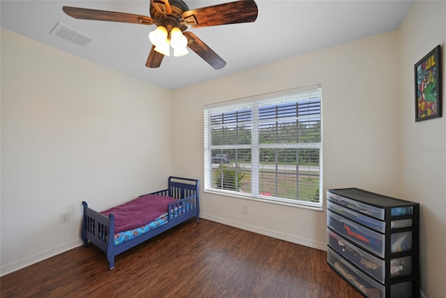 bedroom featuring ceiling fan and dark wood-type flooring