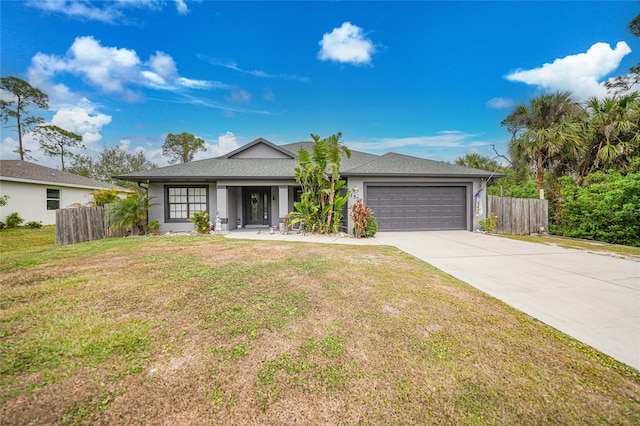 single story home featuring a garage and a front lawn