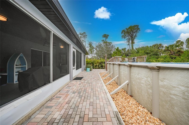 view of patio / terrace with a sunroom