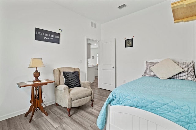 bedroom featuring hardwood / wood-style floors