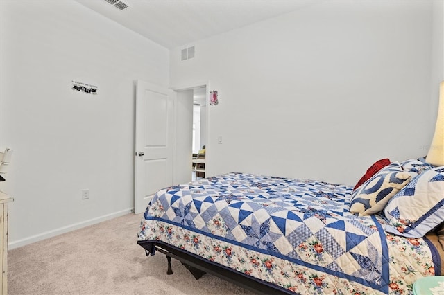 bedroom featuring light colored carpet