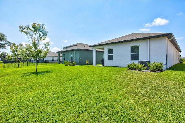 back of house featuring a yard