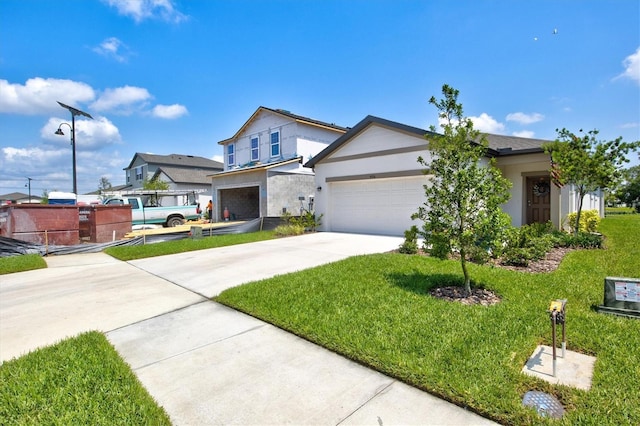 view of front of home featuring a garage and a front lawn