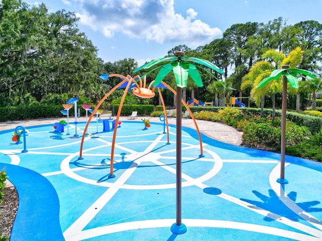 view of property's community with a playground