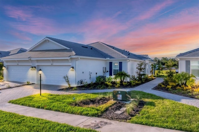 ranch-style home featuring a garage