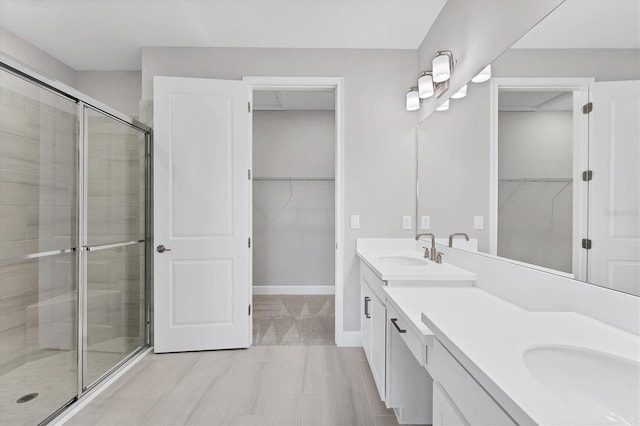 bathroom featuring vanity and walk in shower