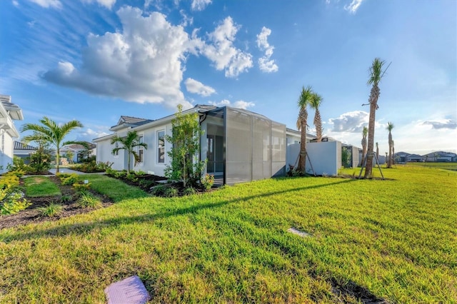 view of property exterior featuring a yard and glass enclosure