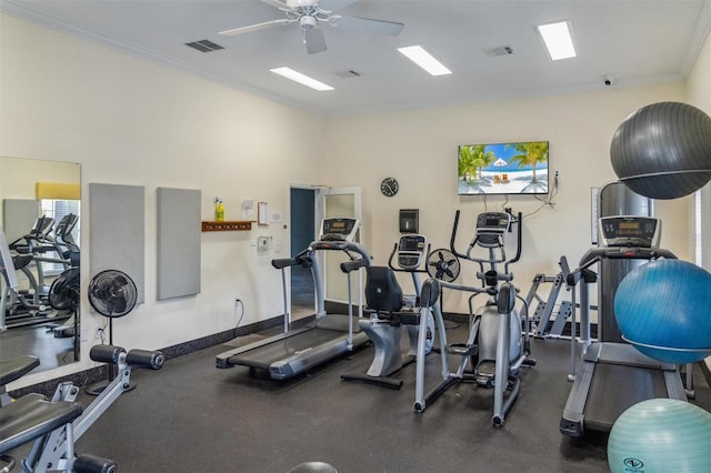 workout area with ceiling fan and ornamental molding