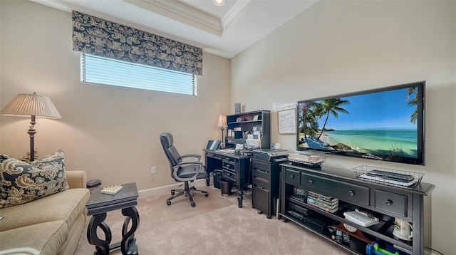 carpeted home office featuring a tray ceiling and ornamental molding