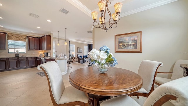 dining room with sink, light tile patterned floors, a notable chandelier, and ornamental molding