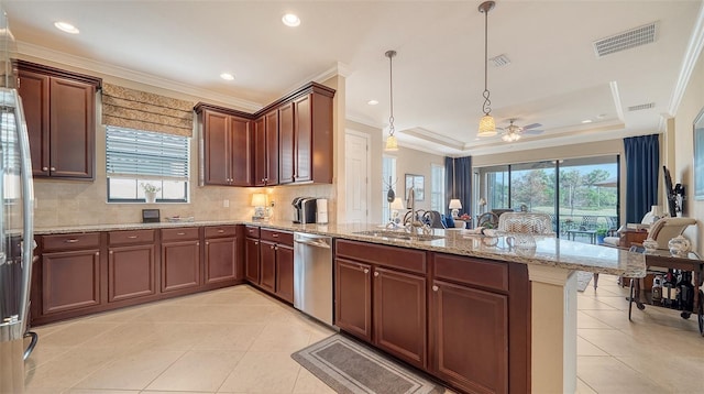 kitchen featuring pendant lighting, dishwasher, a raised ceiling, sink, and kitchen peninsula