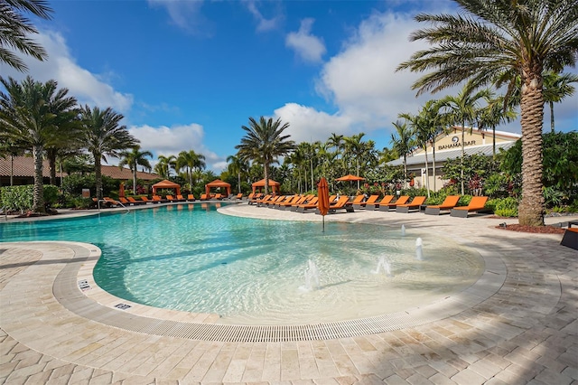 view of pool with pool water feature