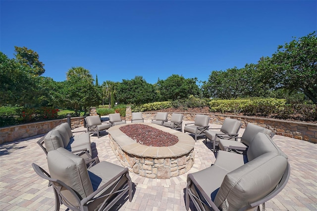 view of patio / terrace featuring an outdoor living space with a fire pit