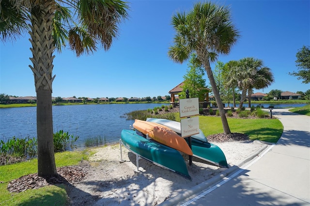 view of home's community with a water view